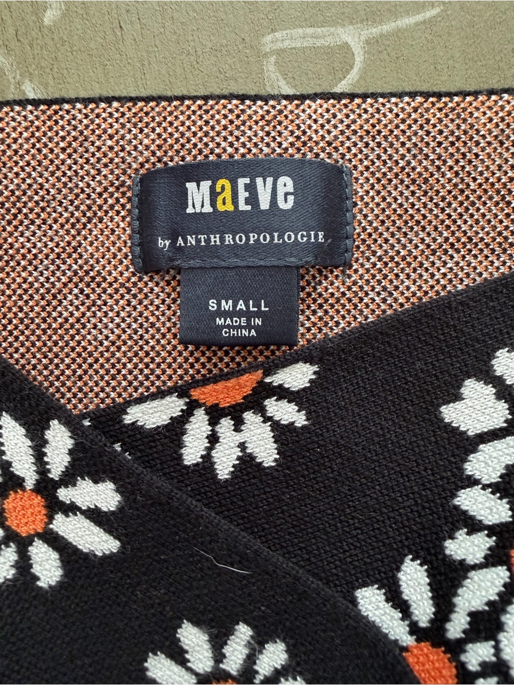 Anthropologie Maeve Black Floral Daisy Knit Top with Orange Centers - Picture 3 of 3
